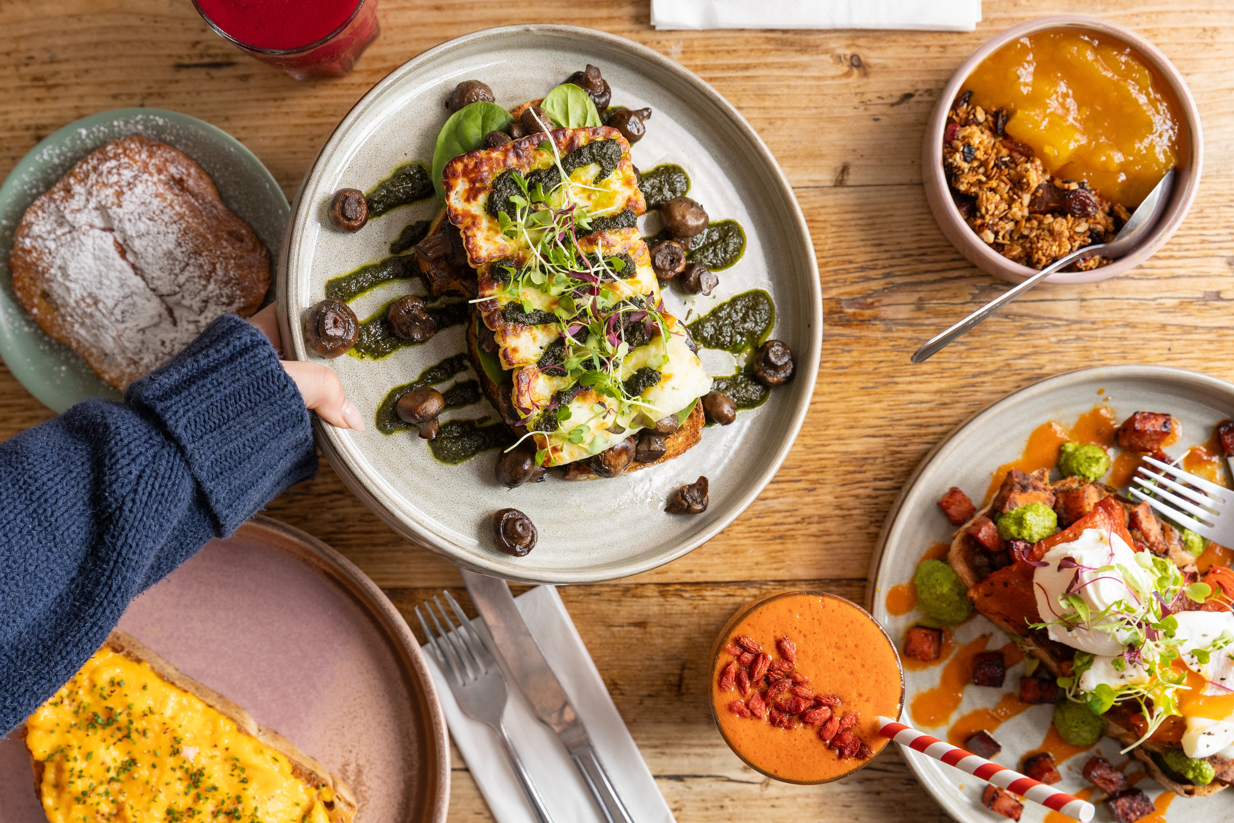 Overhead flatlay of brunch dishes at The Squeeze Cafe